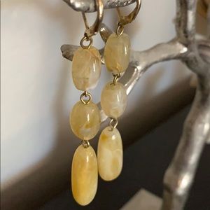 A neutral pair of earrings